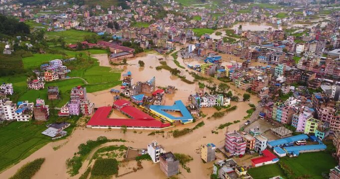 Drone shot of severe monsoon flood in Banepa, Nepal submerging homes with river overflow, highlighting urban vulnerability and drainage issues near Kathmandu.