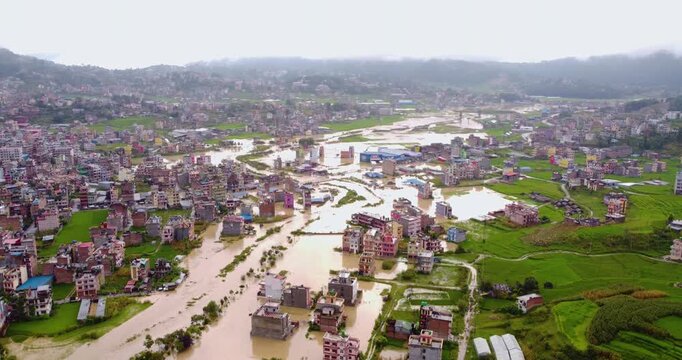 Drone shot of Banepa floodwaters covering buildings and green fields after heavy monsoon rainfall, showing widespread inundation in Nepal.