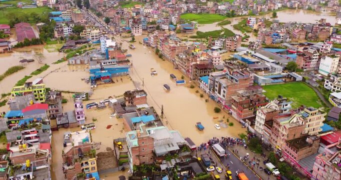 Drone shot of intense monsoon flooding in Banepa covering buildings and disrupting roads due to excessive rainfall, highlighting environmental stress and urban challenges in Nepal.