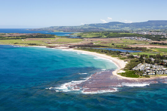 Historic view of Shellharbour South Beach prior to the construction of Shell Cove and Marina, located south of Wollongong on the Illawarra coastline. Captured from high above on a blue sky day. 