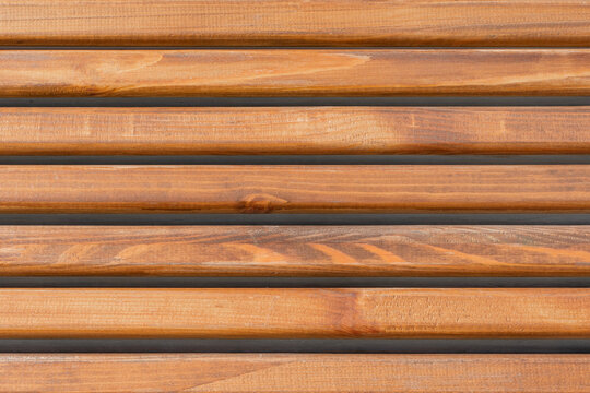 Close-up of horizontal wooden planks with a warm natural texture