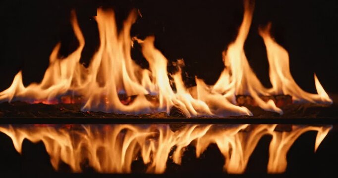 Flickering Flames Reflecting on Dark Surface.