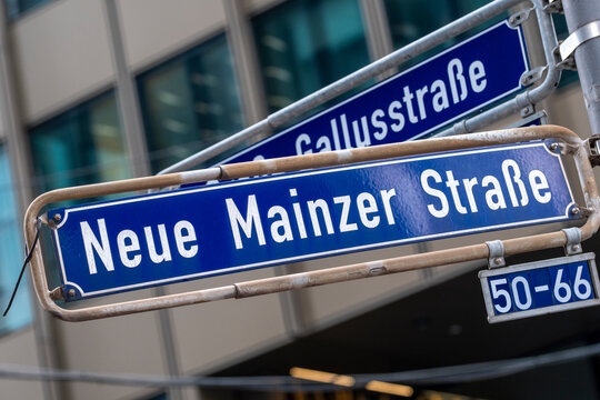Street sign in Frankfurt Bankenviertel Germany marks Mainzer and Gallusstrasse as urban navigation near corporate offices and towers