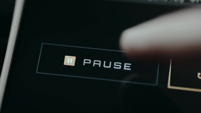 Finger taps the PAUSE menu button