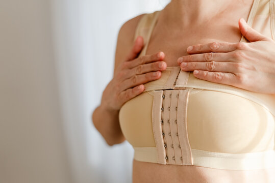 A woman receiving support during postoperative period after breast reconstruction. Emotional and physical care.