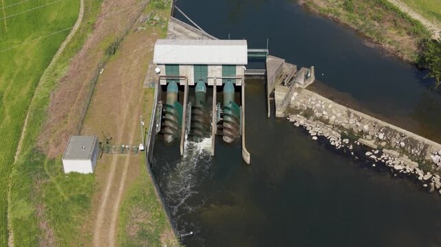 Drone view of small hydropower plant on Lambro River in Lombardy, Italy