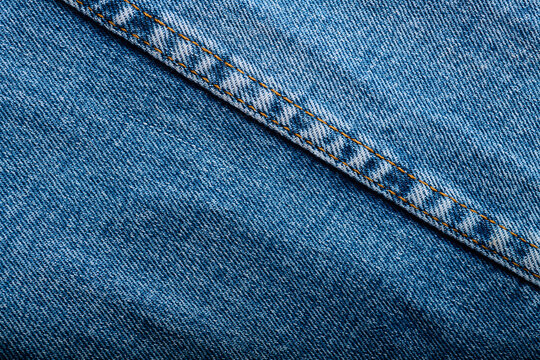 Close-up of the stitching on an old pair of jeans