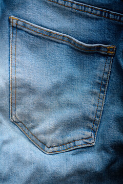 Close-up of the back pocket of an old pair of jeans.