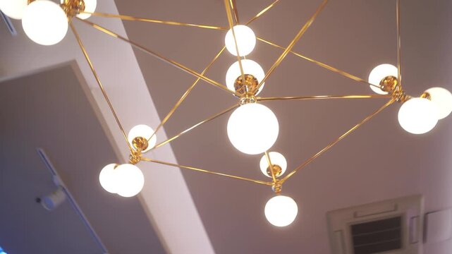 Wedding decoration with antique crystal chandeliers with candles. Glass pendants in the form of balls. A light bulb in the shape of a candle