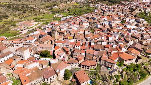 Aerial view of fermoselle spanish village pulling back from cliffside houses