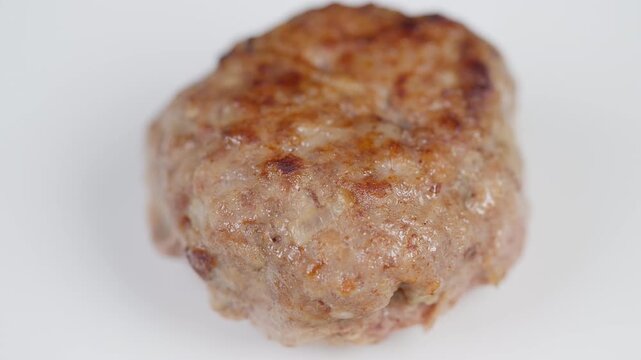 Closeup of savory cutlet. Studiolit image showcasing crispy crust and tender interior. Food photography featuring homemade golden cutlet with browned edges and oil sheen