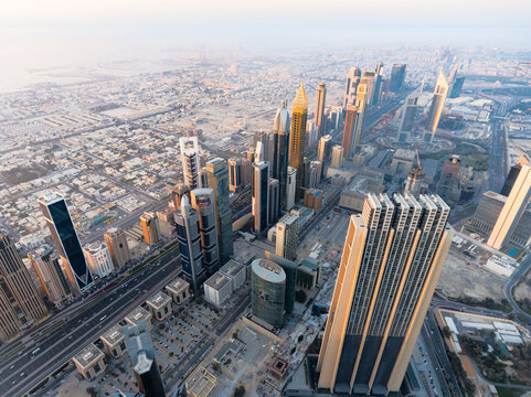 Aerial view of Dubai's futuristic urban skyline in downtown during sunset