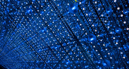 an immersive light art installation, likely featuring thousands of hanging LED lights to create a...