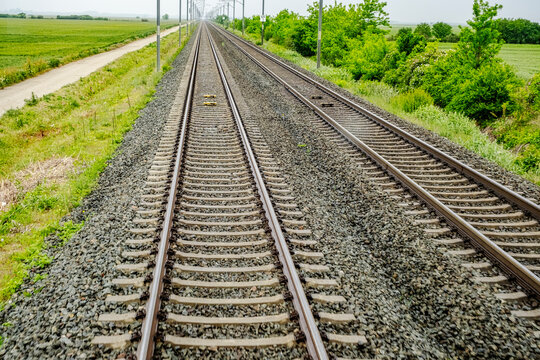 a set of parallel railway tracks stretching into the distance