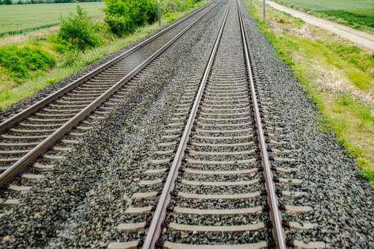 a set of parallel railway tracks stretching into the distance