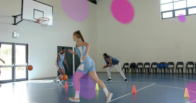 Male player dribbling baseline and passing to teammate for sports practice, pink overlays appearing