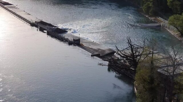 Small river dam in function liberating water to prevent floods in a european country.