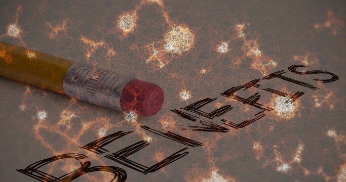 Erasing yellow pencil eraser rubbing out BULLIES on paper at desk, glow overlay, copy space