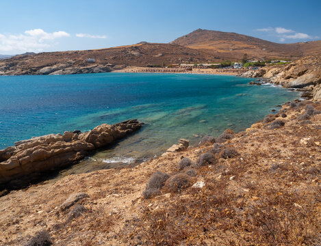 Panoramic view of Lia beach with tourists on the island of Mykonos in Greece.