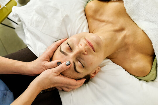 Facial massage and beauty treatment during relaxing spa session