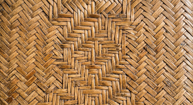 Natural Indonesian rattan weave texture with tight handcrafted pattern and warm honey beige tones, close up artisanal background.generative AI