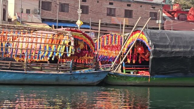 Scenic view from a moving boat at Ram Ghat in Chitrakoot, Madhya Pradesh, on the sacred Mandakini River. This spiritual riverside location is associated with Lord Rama, Sita, and Lakshman.