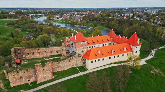 Drone panorama of Bauska Castle and flowing rivers in Latvia