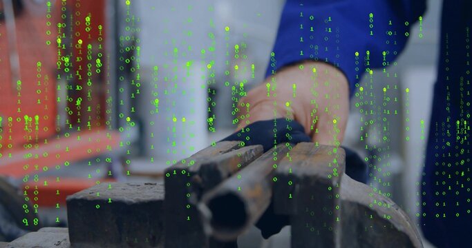 Holding rusty pipe in blue work shirt, steadying pipe at workshop bench vise with binary overlay