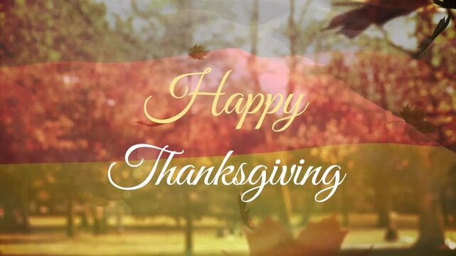 Animation of happy thanksgiving over fall landscape, leavers and flag of germany