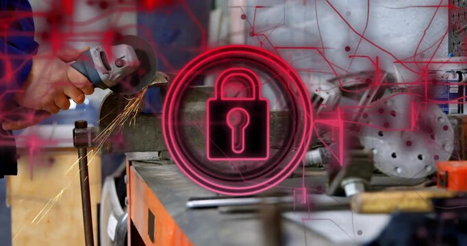 Worker grinding in vise on bench sparks causing neon padlock circuitry showing industry security