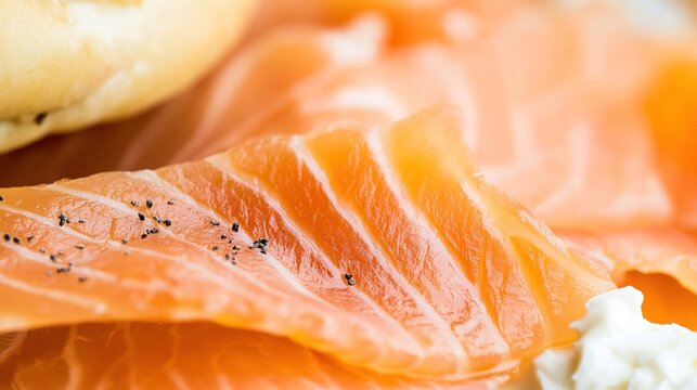 bagel. Single slice of orange-pink smoked salmon on cream cheese and bagel. menu design, packaging mockups, designed for food delivery and cloud-kitchen brand materials, used by curriculum designers.