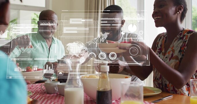 Sharing family in casual clothing passing plate at home table, with patterned tablecloth and HUD