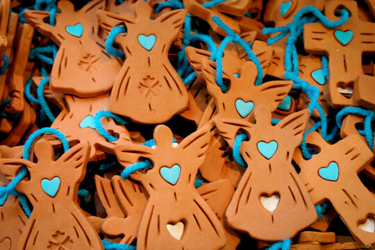 Small clay angel ornaments with turquoise hearts