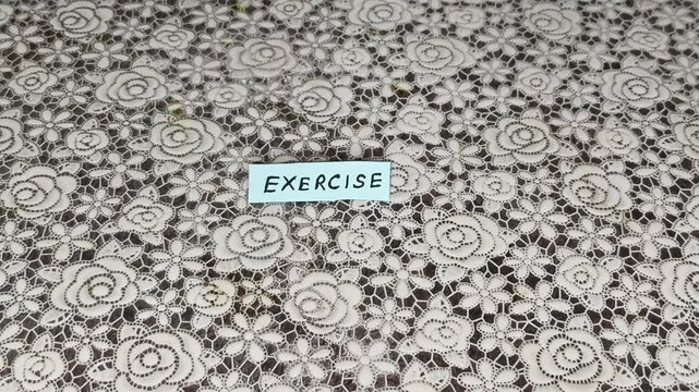 Hand remove unnecessary medicine supplement pills, tablets and capsules revealing exercise word or text. Concept of managing or stay away from disease like diabetes, cholesterol, pressure medications.