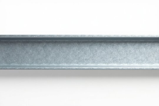 Close-up view of a galvanized steel I-beam against a clean white background, showcasing its metallic texture and structural design elements.