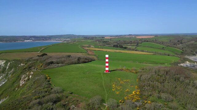 
Gribbin Head, Cornwall, England: DRONE VIEWS: A circling shot of the Gribbin Daymark (Gribbin Head Tower). The Daymark was erected in 1832 as an aid for seafarers to identify the River Fowey estuary.