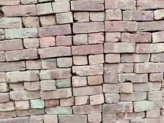 Obraz premium Close up shot of pile of red clay bricks.