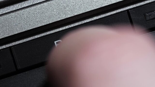 Black both button with white text being pressed on vintage video controller