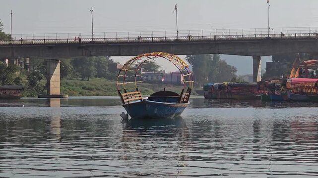 Scenic view from a moving boat at Ram Ghat in Chitrakoot, Madhya Pradesh, on the sacred Mandakini River. This spiritual riverside location is associated with Lord Rama, Sita, and Lakshman.