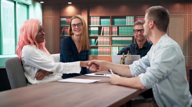 Couple Shaking Hands After Successful Divorce Meeting