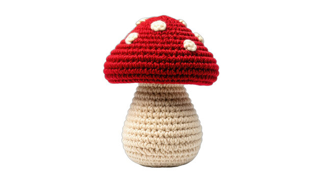 A charming, handcrafted crocheted mushroom with white polka dots sits against a stark black background, showcasing intricate detail and a whimsical aesthetic.