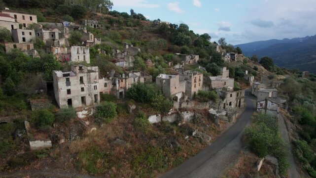 Stunning aerial footage revealing the deserted ruins of Gairo Vecchio. The crumbling stone houses of this ghost town cling to a Sardinian hillside