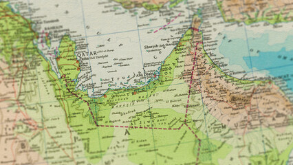 Fototapeta premium Macro View of Vintage Map Highlighting Trucial States and UAE with Detailed Historical Cartography