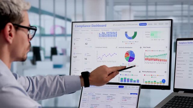 Data Privacy Officer Carefully Reviews Compliance Dashboard Ensuring Security