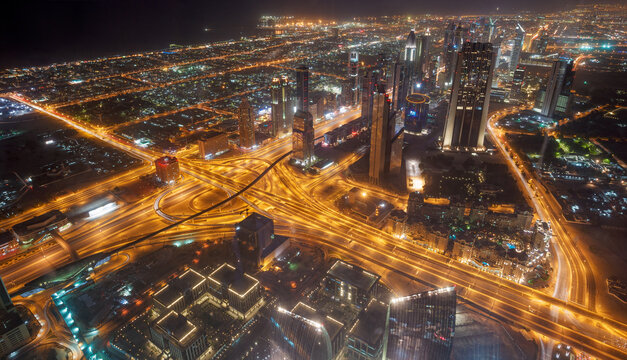 Dubai Night Aerial View of Highway Interchange and Illuminated Cityscape