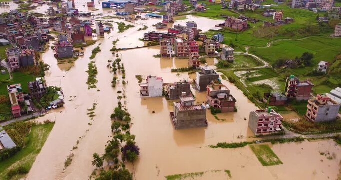 Drone shot of floodwaters in Banepa Nepal covering land and buildings, showing widespread inundation and impact of heavy monsoon rainfall.