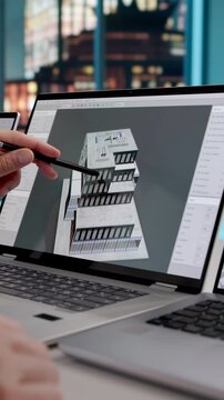 Architect Studies 3D Model Designs On Laptop