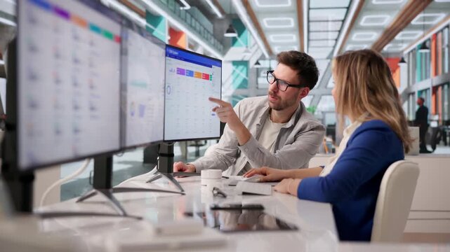 Software Developer Discussing CRM Features During Meeting