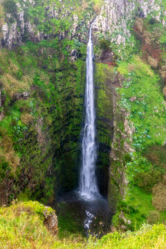 Tall scenic waterfall at Miradouro da Garganta Funda Madeira Portugal