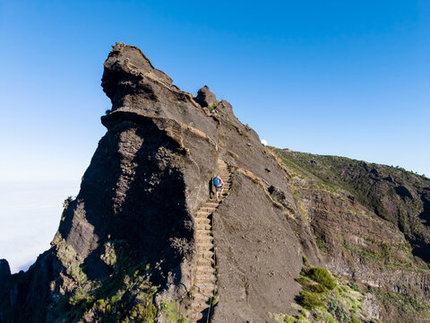 Tourist hiking on Stairway to Heaven at Pico do Arieiro Madeira aerial view